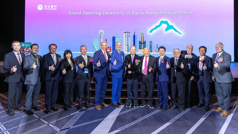 Executives at E.SUN Bank stand on stage to celebrate the opening of the bank's new Dallas...