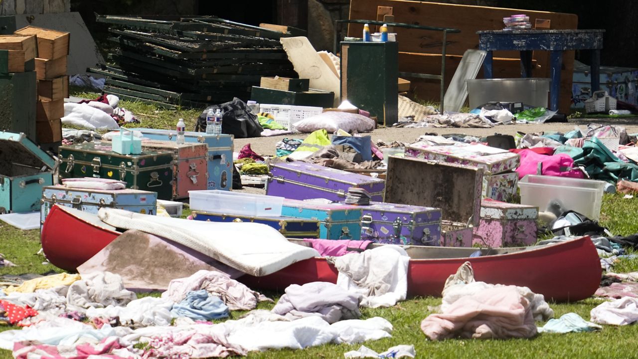 Personal items sit outside cabins at Camp Mystic in Hunt, Texas on Wednesday, July 9, 2025. (AP Photo/Ashley Landis)