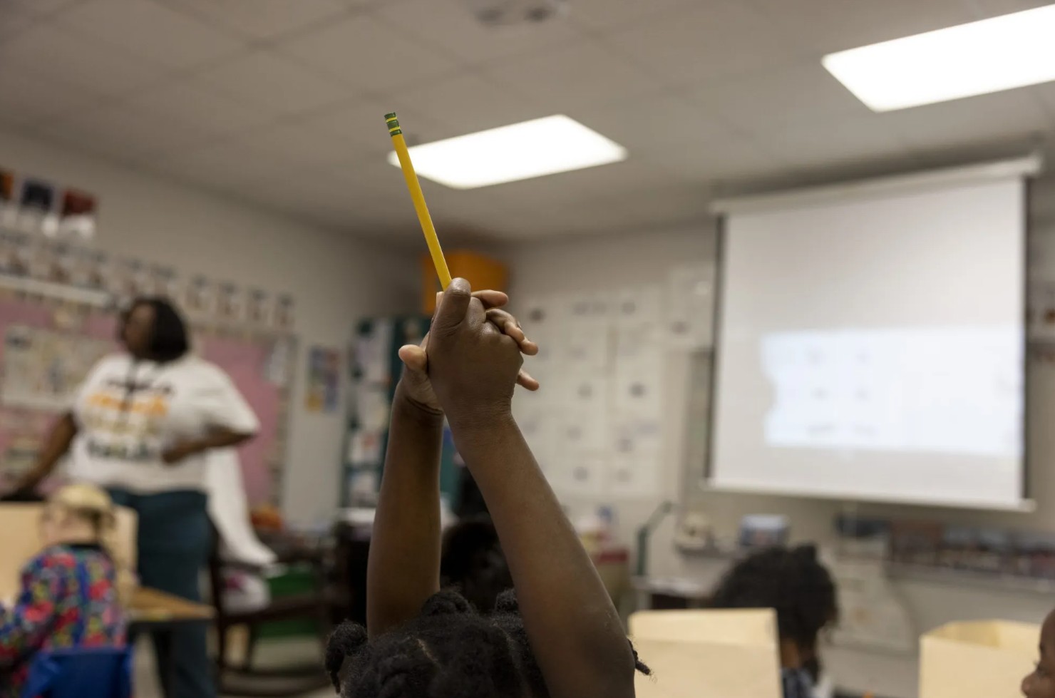 Classroom Student Raising Pencil