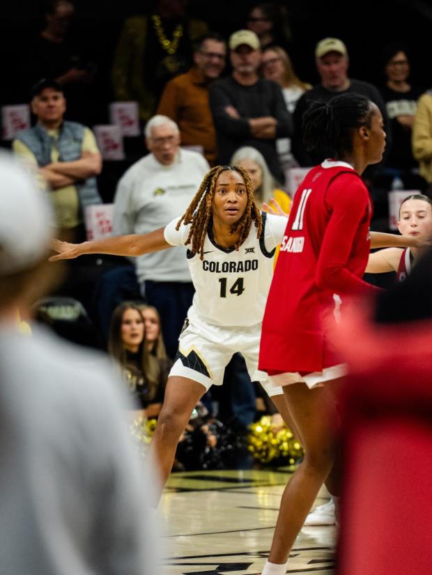Colorado's Jade Masogayo (center) defends against Texas Tech's Sarengbe Sanogo during a game on Feb. 21, 2026, at the CU Events Center in Boulder, Colorado. (CU Athletics)