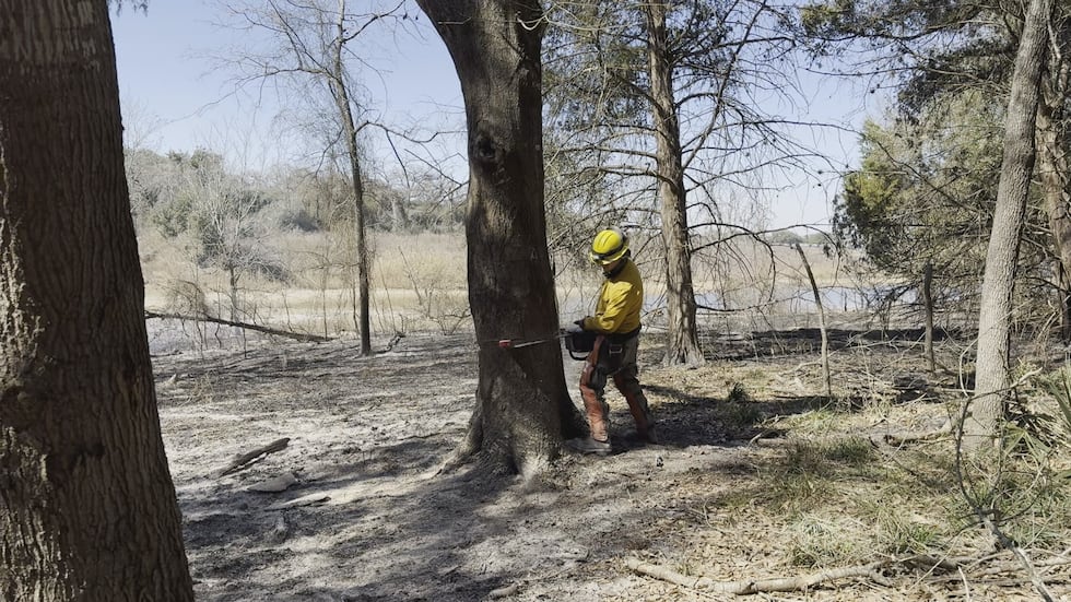 Crews ensure the wildfire does not reignite.