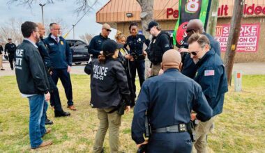 Officers from multiple local and federal law enforcement agencies conduct a sting on a Dallas adult bookstore on Friday, Feb. 13, 2026.