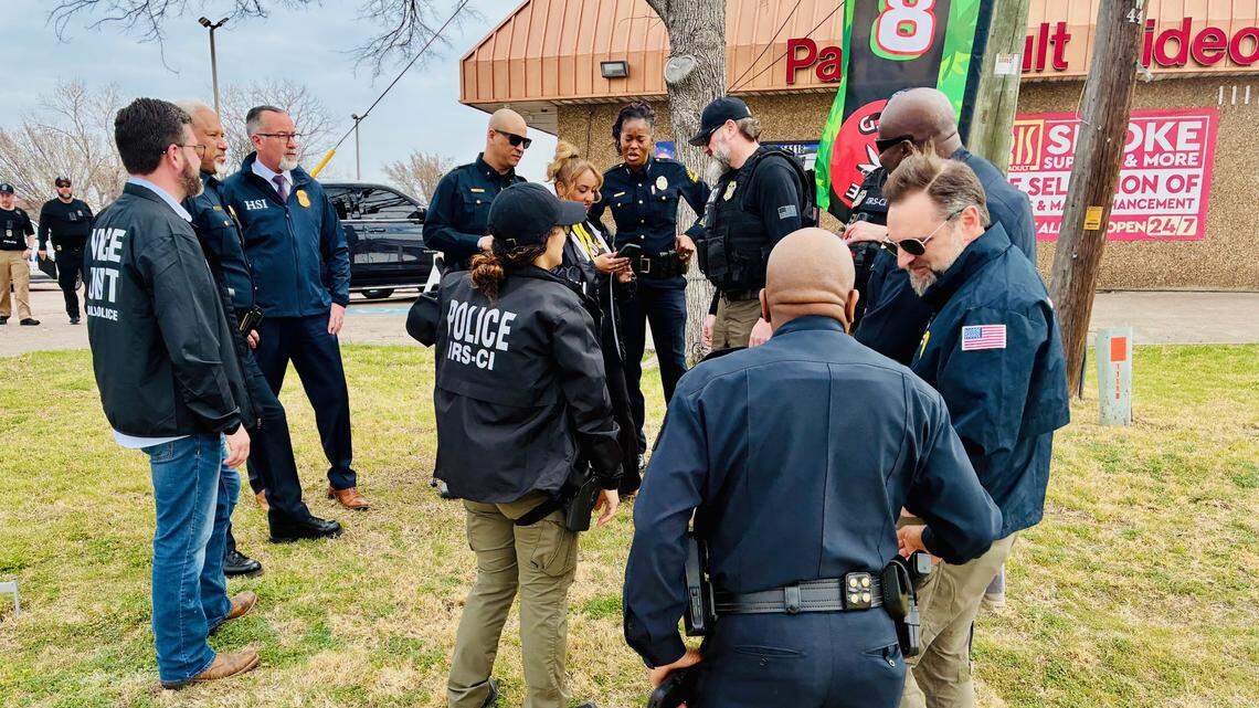 Officers from multiple local and federal law enforcement agencies conduct a sting on a Dallas adult bookstore on Friday, Feb. 13, 2026.