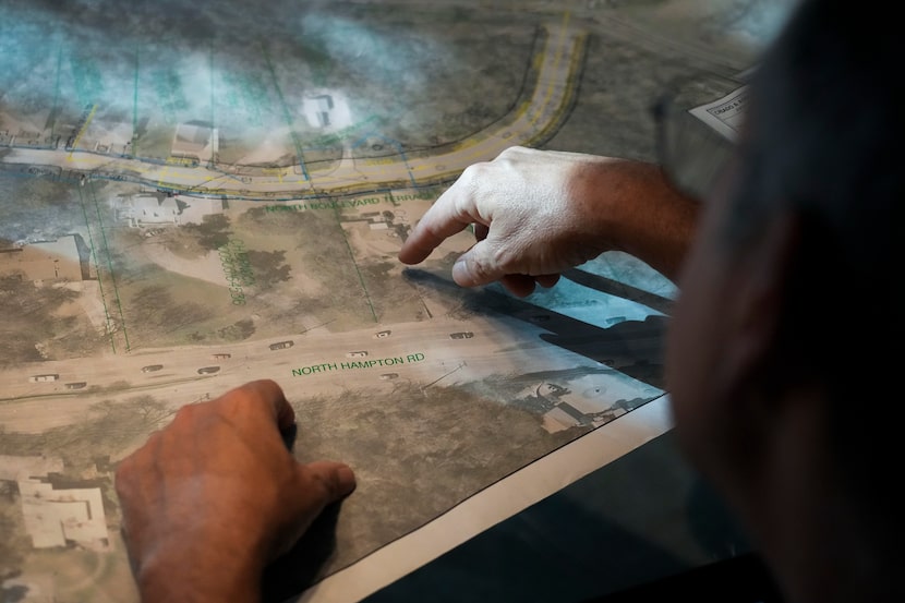 Joseph Beckham points to land proposed for rezoning as a multifamily district on a map of...