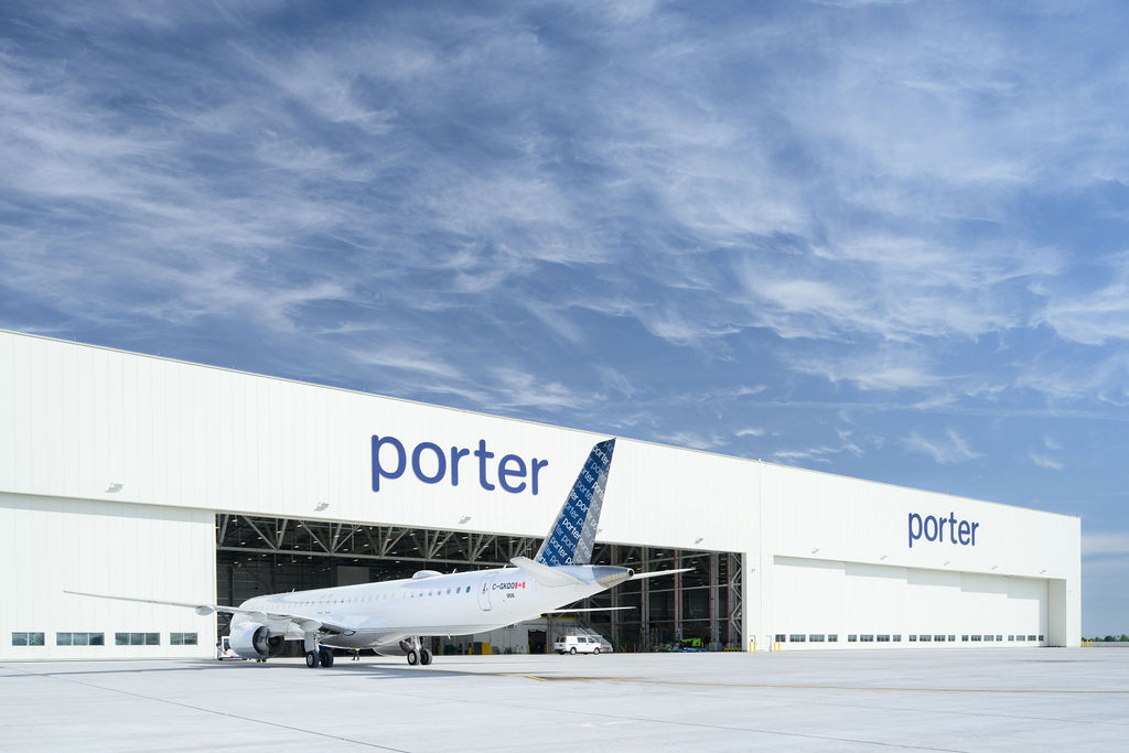 A Porter Airlines Embraer parked in front of the hangar at YOW.