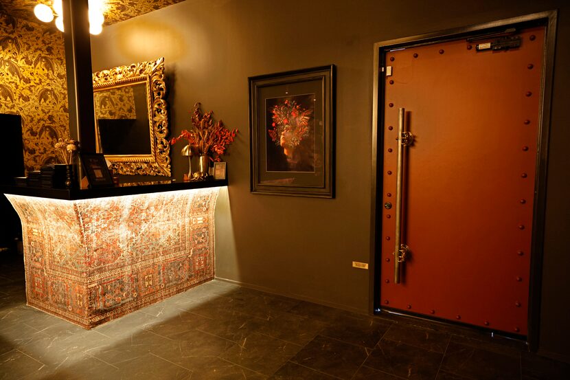 Pull on a long handle with rooster claws and walk into the Dallas Design District's sultry...