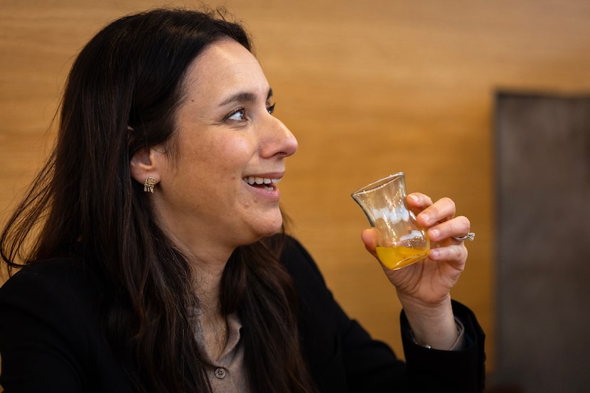 State Rep. Gina Hinojosa, a democrat candidate for governor, drinks an immunity shot at...