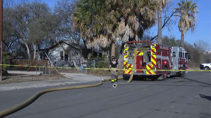 South Side house fire started after domestic dispute, may have caused separate grass fire