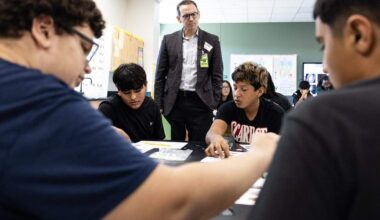 Mike Morath, the Texas Commissioner of Education, interacts with students on their classwork in a science class at Lucyle Collins Middle School in Lake Worth on Tuesday, Oct. 21, 2025.