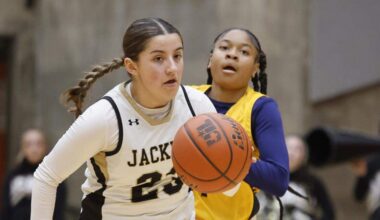 Cleburne guard Alyssa Franklin (23) brings the ball down court ahead of Arlington Heights guard Hope West (1) during the first half of the UIL 5A D1 girls bi-district championship basketball game at Wilkerson Greines Activity Center in Fort Worth, Texas, Monday Feb. 16, 2026.