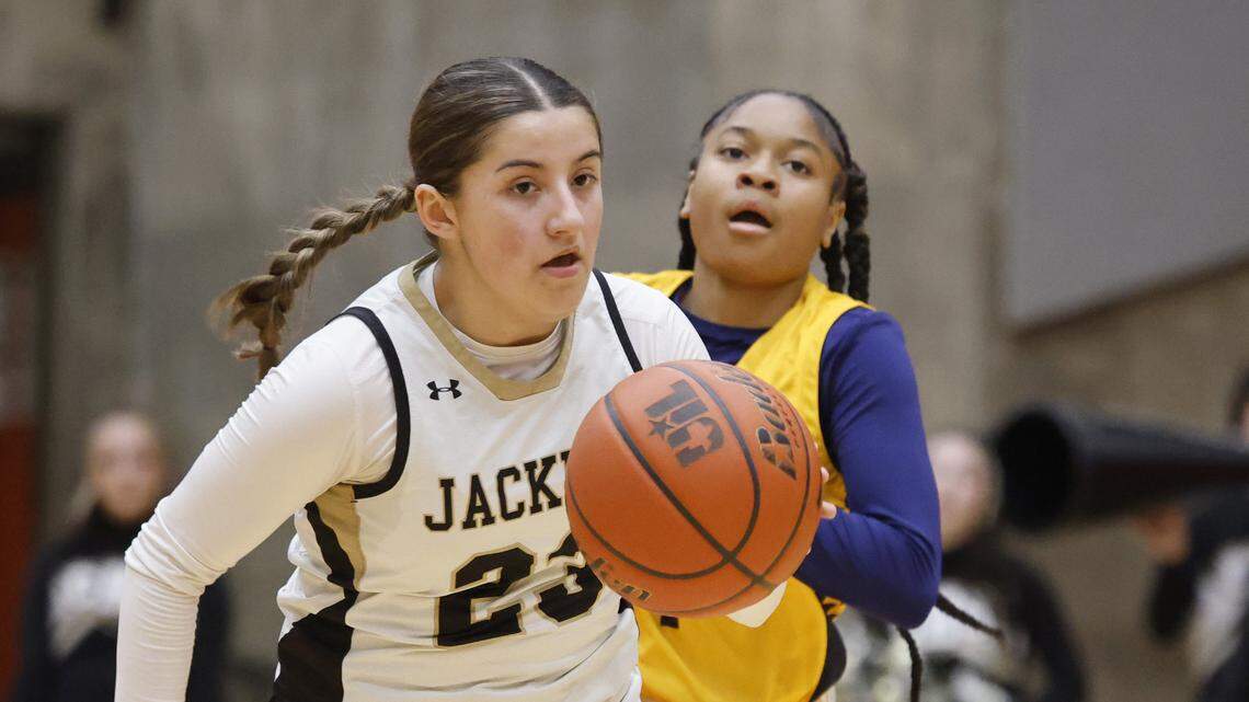 Cleburne guard Alyssa Franklin (23) brings the ball down court ahead of Arlington Heights guard Hope West (1) during the first half of the UIL 5A D1 girls bi-district championship basketball game at Wilkerson Greines Activity Center in Fort Worth, Texas, Monday Feb. 16, 2026.