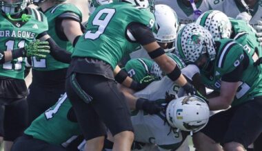 DeSoto running back Sarod Baker is engulfed by the Southlake Carroll defense during a 6A Division 2 playoff game in December. All 6A schools are required to report concussion data to the UIL.