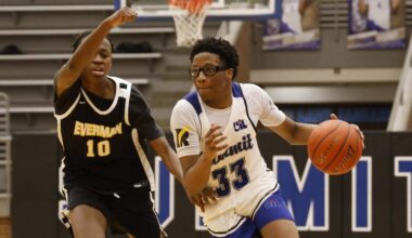 Mansfield Summit guard Javon Ross (33) drives against Everman forward Brandon Watts (10) during the second half of a UIL boys basketball game between Everman and Mansfield Summit at Summit High School in Mansfield, Texas, Thursday Jan. 22, 2026