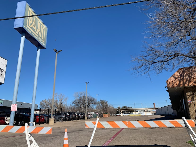 All is quiet in the Paris Adult Book Store parking lot now. It wasn't this way, oh, a week...
