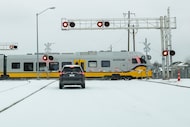 A DART Silver Line train passes Custer Road during a winter storm on Sunday, Jan. 25, 2026,...