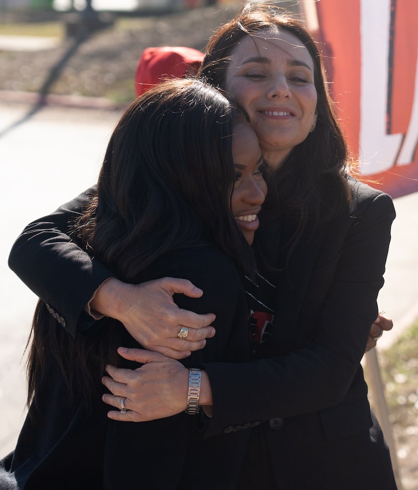 State Representative Gina Hinojosa, right, hugs Congresswoman Jasmine Crockett during a...