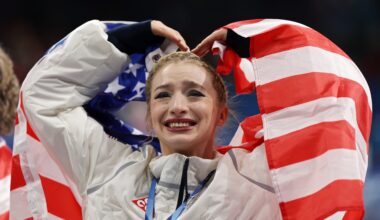 MILAN, ITALY - FEBRUARY 08: Gold medalist Amber Glenn of Team United States acknowledges the crowd following the Medal Ceremony for the Team Event after the Men