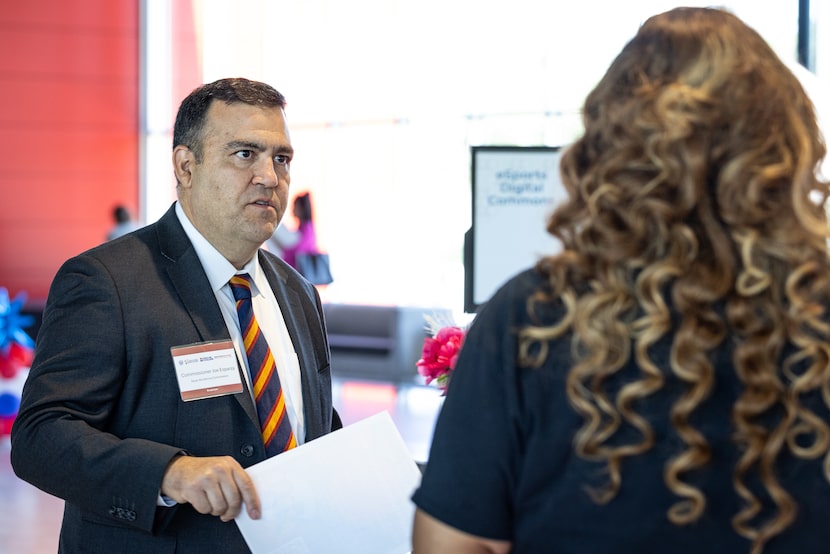 Texas Workforce Commissioner Joe Esparza speaks to vendors during an internship conference...