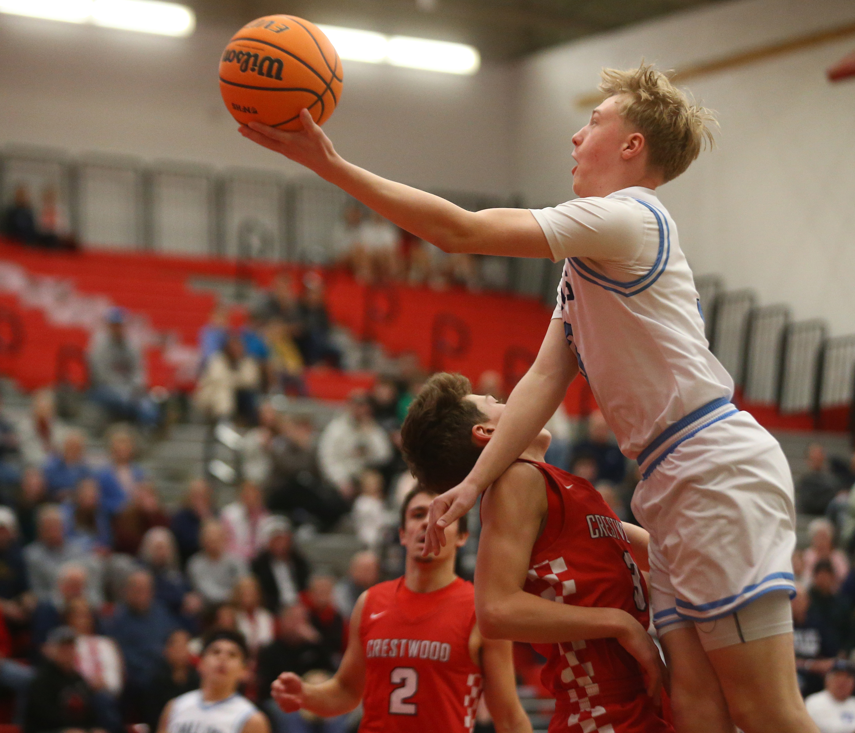 Dallas Kael Berry (3) goes up for two as Crestwood...