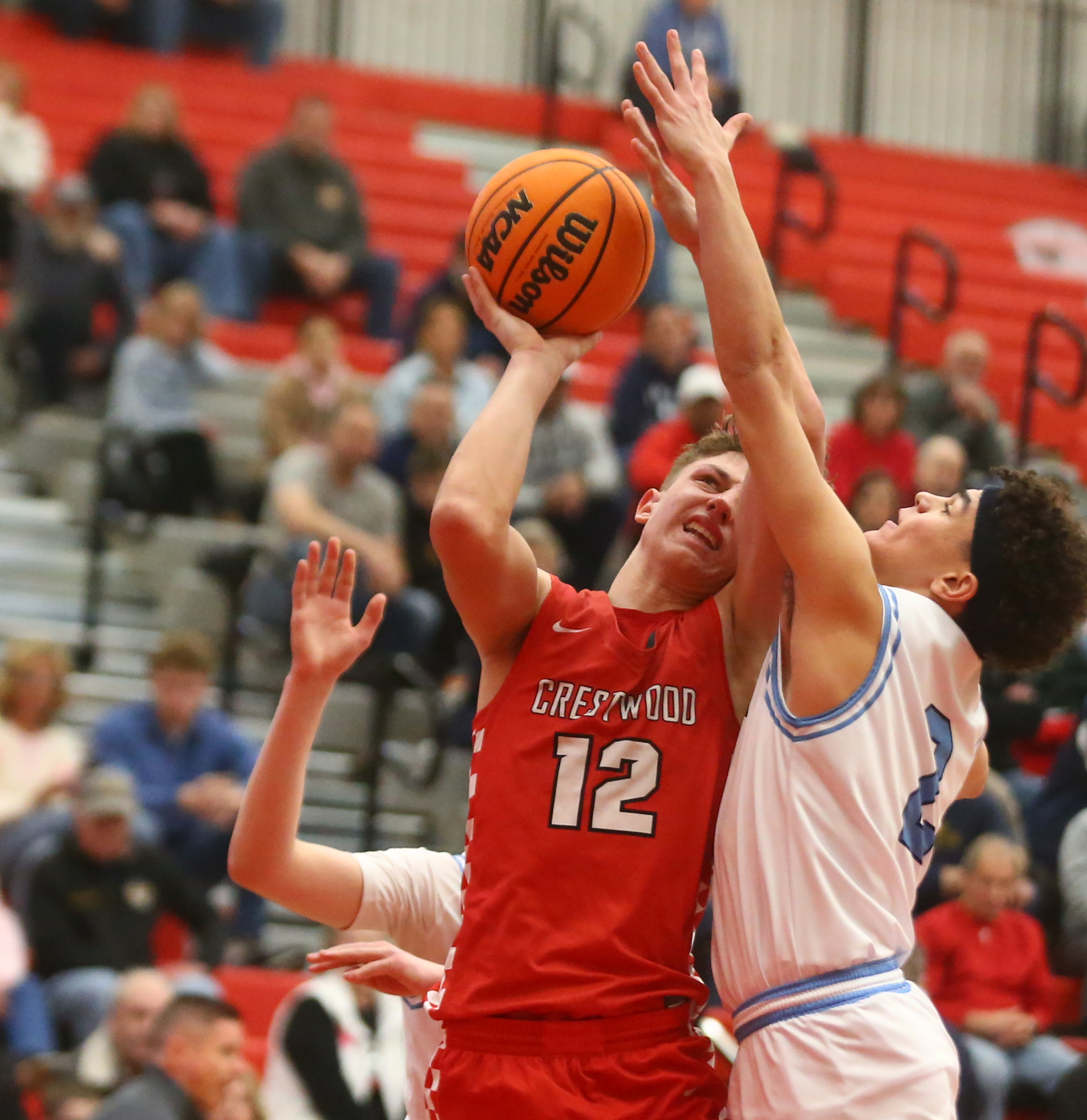 Crestwood Jack Rogers (12) goes up for two as Dallas...