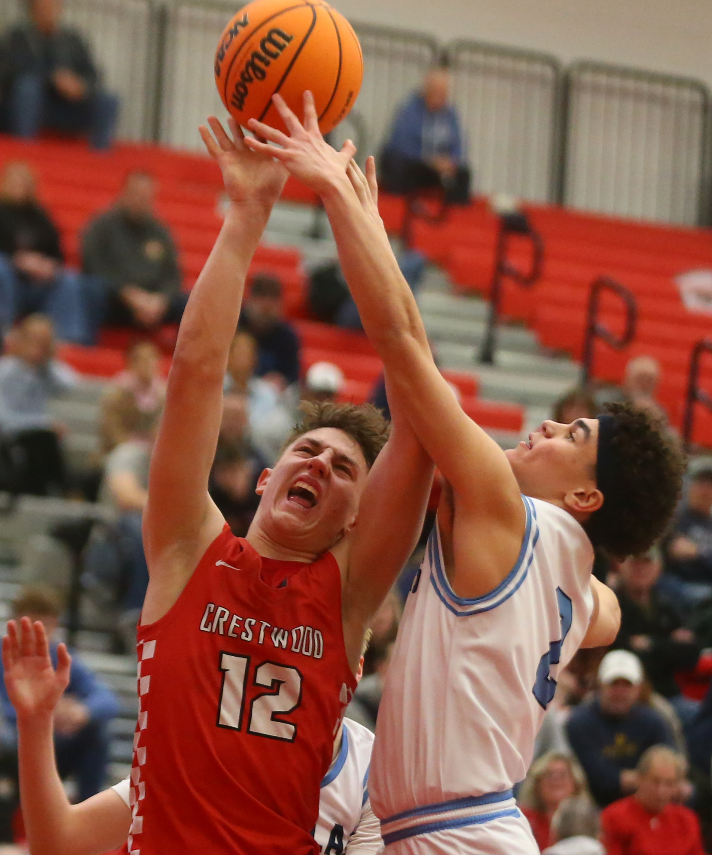 Crestwood Jack Rogers (12) goes up for two as Dallas...