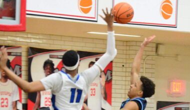 North Crowley’s Trey Hall (11) goes up to block the shot of Hurst L.D. Bell’s Roman Washington, right, in a Class 6A Division I bi-district game on Monday, February 23, 2026 at Martin High School in Arlington, Texas.
