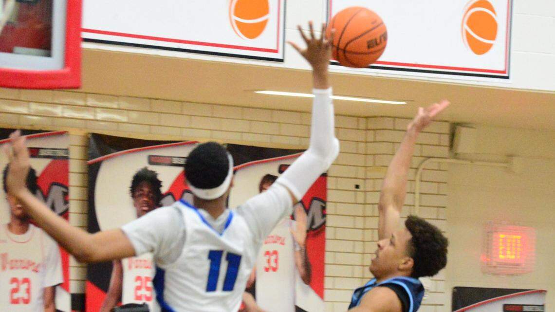 North Crowley’s Trey Hall (11) goes up to block the shot of Hurst L.D. Bell’s Roman Washington, right, in a Class 6A Division I bi-district game on Monday, February 23, 2026 at Martin High School in Arlington, Texas.