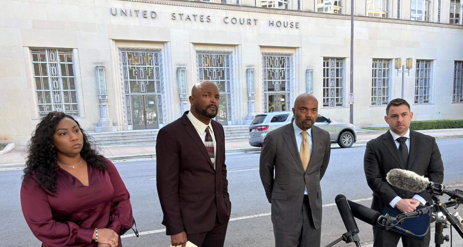 Former Sheriff’s Deputy Phillip Hill (right) stands next to attorney Daryl Washington and fellow former Sheriff’s Deputies Brandon Walker and Nyla Coleman across from the federal courthouse in downtown Fort Worth during a press conference on Oct. 16, 2024.