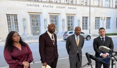 Former Sheriff’s Deputy Phillip Hill (right) stands next to attorney Daryl Washington and fellow former Sheriff’s Deputies Brandon Walker and Nyla Coleman across from the federal courthouse in downtown Fort Worth during a press conference on Oct. 16, 2024.