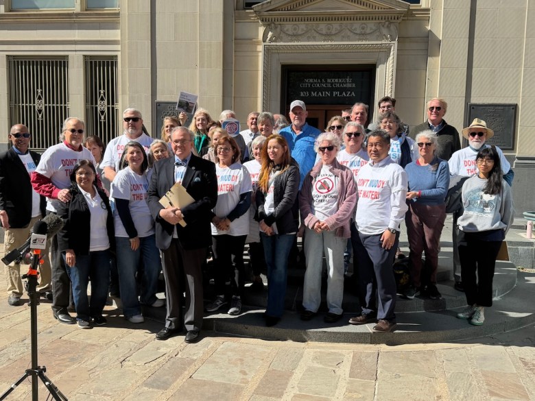 Members of the Greater Edwards Aquifer Alliance and the Scenic Loop-Helotes Creek Alliance pose for a photo after Thursday's victory over Lennar Corp.