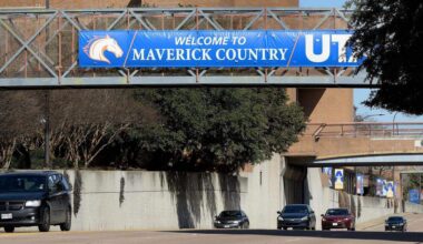 Cars travel on Cooper Street through the heart of the UTA's where enrollment is up 28 percent over 5 years ago.