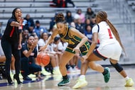 Cedar Hill girls head coach Nicole Collins (left) instructs as DeSoto High’s Mylasia Smith...