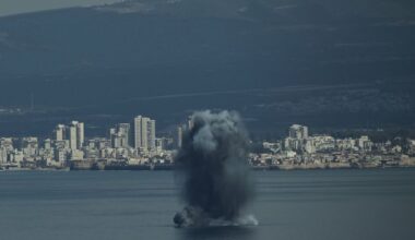 An incoming projectile explodes over the water as Israel issues a nationwide alert following its strikes on Iran, in Haifa Bay, northern Israel, Saturday, Feb. 28, 2026. (AP Photo/Leo Correa)