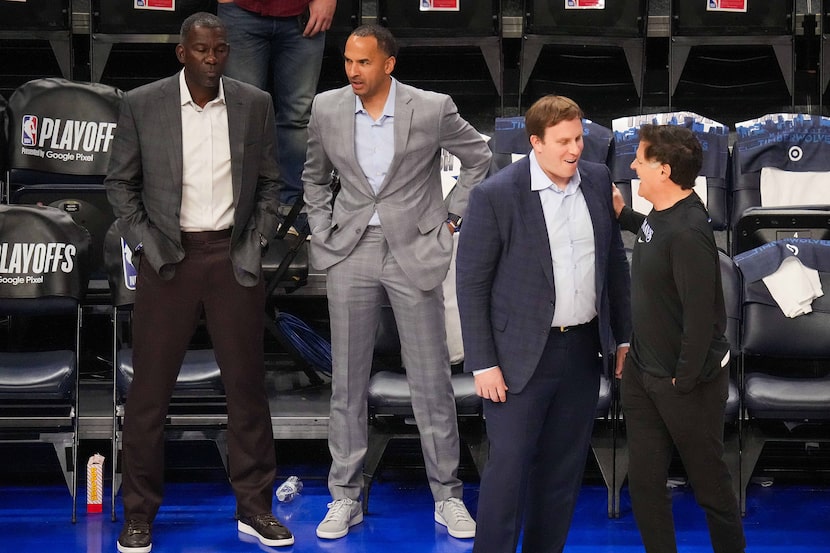 Dallas Mavericks governor Patrick Dumont (second from right) talks with minority owner Mark...