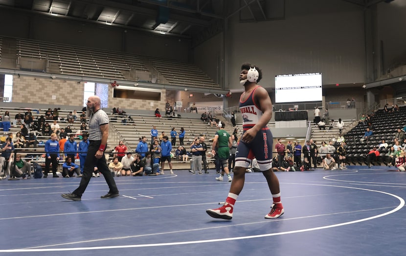 Dallas Kimball wrestler Quintraylon Johnson circles the mat prior to the start of his match...