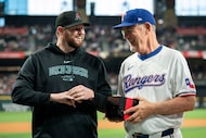 Texas Rangers manager Bruce Bochy, right, presents Arizona Diamondbacks pitcher Jordan...
