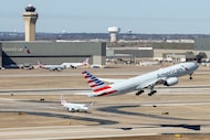 An American Airlines Boeing 777-200 bound for Hawaii takes off at DFW International Airport,...