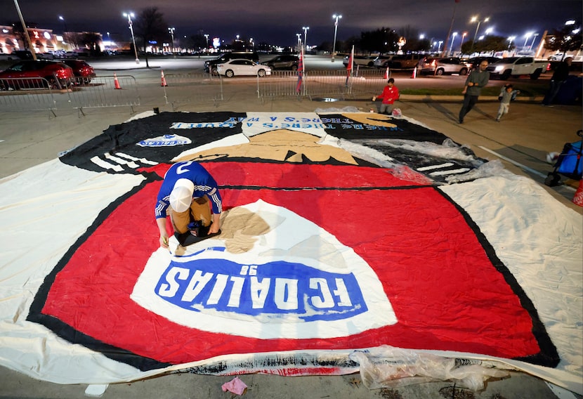 FC Dallas soccer supporter Steven Goold of Carrolton paints a huge tifo depicting new head...