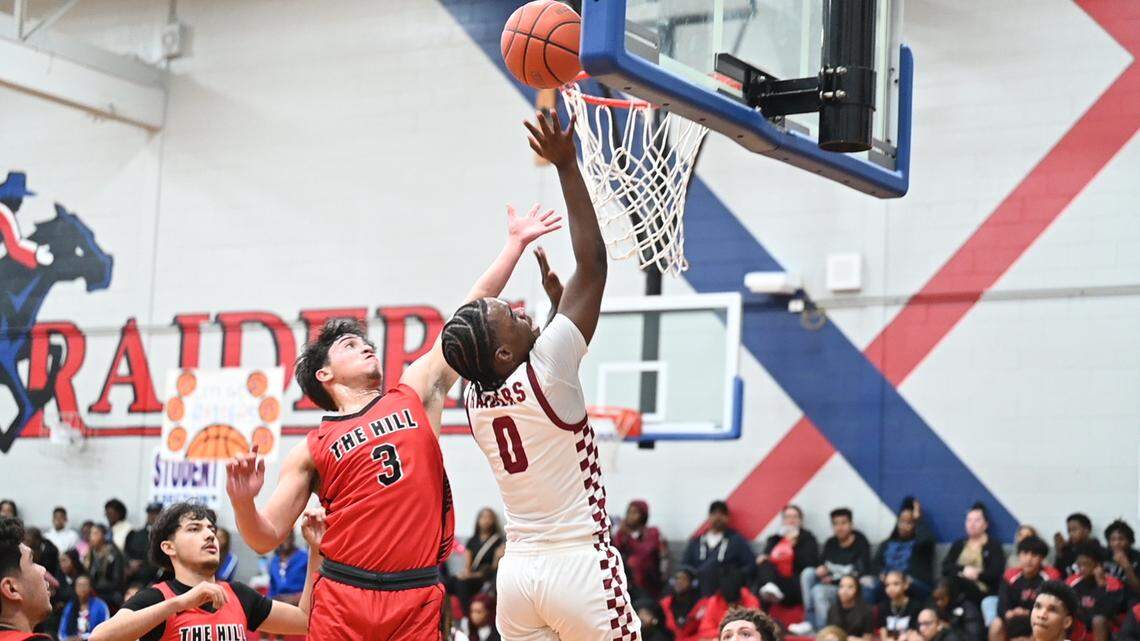 Fort Worth Southwest guard Orion Sylvestre (0) goes up for 2 of his game-high 21 points against Fort Worth Diamond Hill-Jarvis guard Anthony Elizondo (3) in a District 8-4A game on Tuesday, February 3, 2026 at Southwest High School in Fort Worth, Texas.