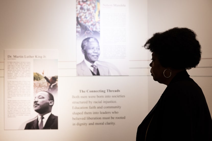 Diane Ragsdale, a community advocate, views the "Icons of Liberation" exhibit at the African...