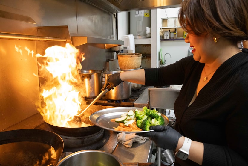 Irean Wongchingchai prepares Pad See Ew with shrimp on the wok at Thai Soon in Richardson.