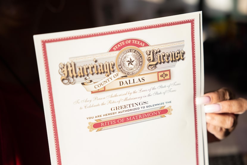 Deputy clerk Charlene Jackson holds up a blank Marriage License at the Dallas County Clerk’s...
