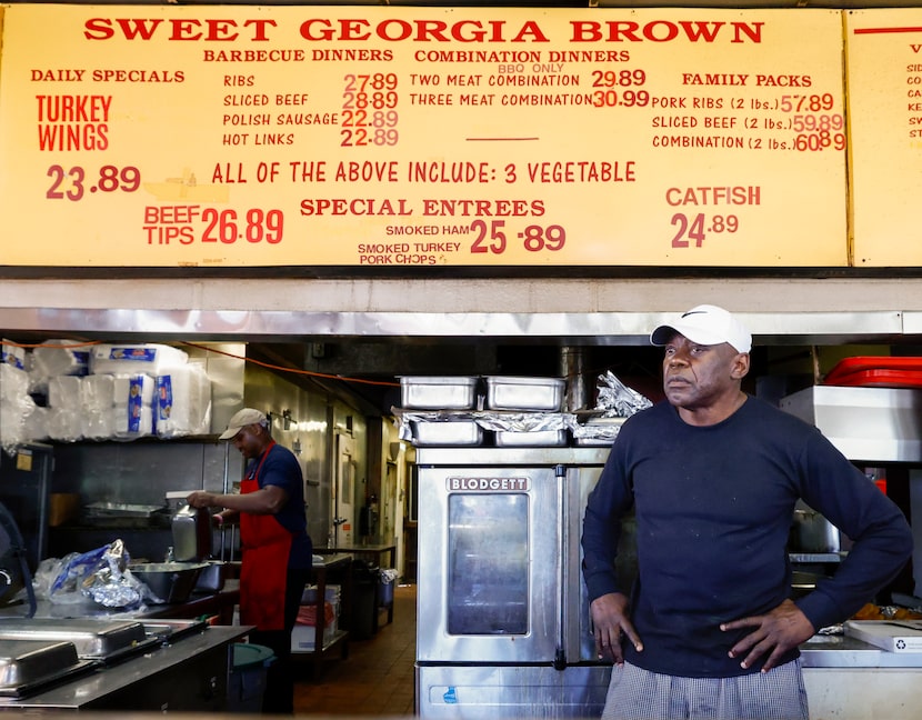 Owner Walter Williams watches customers are served during the lunch hour at Sweet Georgia...