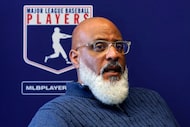 FILE - Major League Baseball Players Association Executive Director Tony Clark answers a...