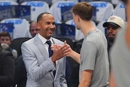Dallas Mavericks general manager Nico Harrison (left) greeted forward Cooper Flagg on the...