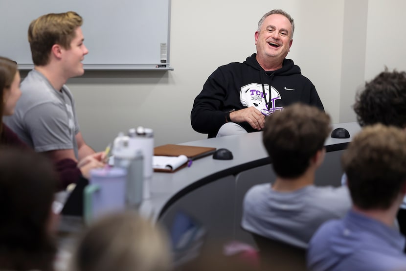 TCU football coach Sonny Dykes laughs with students as he teaches a leadership class at the...