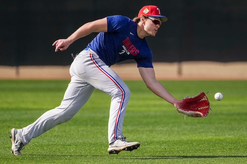 Texas Rangers minor league outfielder Max Martin participates in a fielding drill during of...