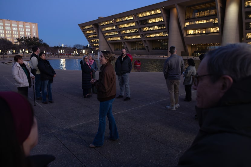 Sarah Crain, executive director of Preservation Dallas, speaks to attendees at a tour of...