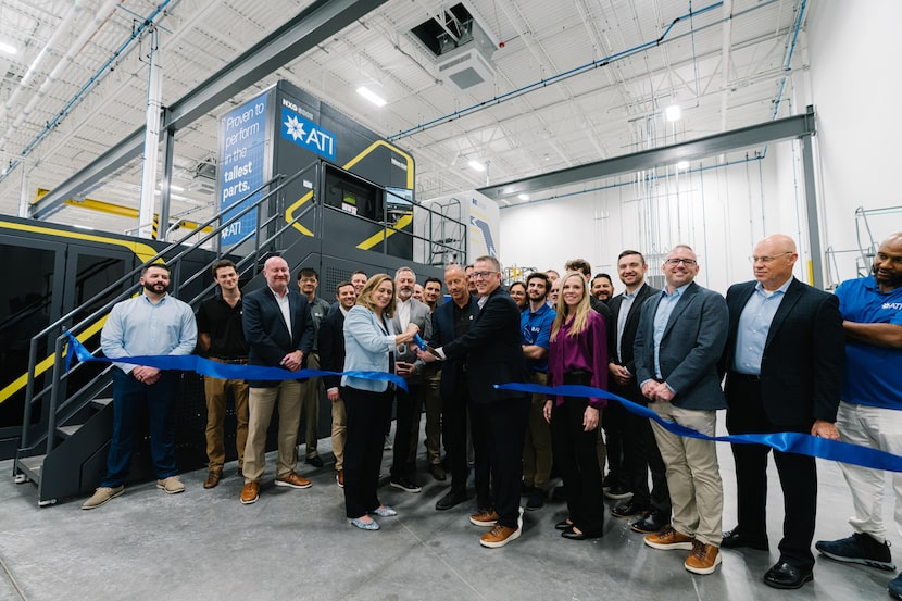 President and CEO of Dallas-based ATI Inc., Kimberly Fields cuts the ribbon at a new facility.