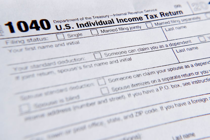 A 1040 tax form printed from the Internal Revenue Service web page is seen, Feb. 13, 2019,...